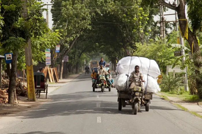Framed Print : Jessore, Bangladesh. The main route into Jessore is busy with crops being transported