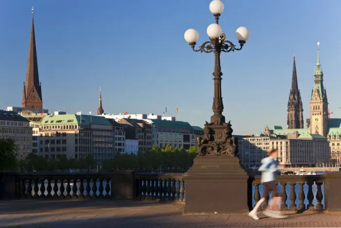 Framed Print : Jogger & City Skyline by Binnenalster Lake, Hamburg, Germany Framed Print : Jogger & City Skyline by Binnenalster Lake, Hamburg, Germany