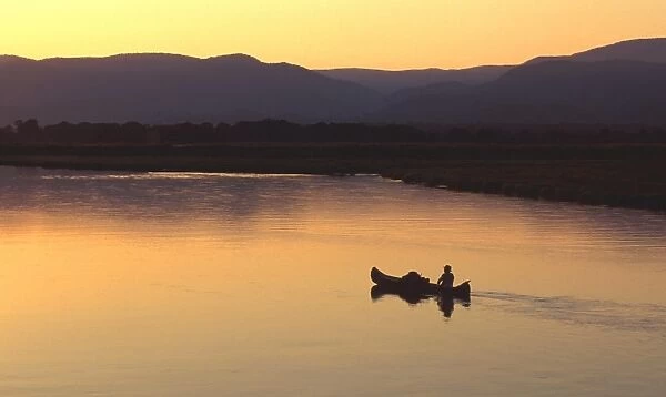 John Stevens paddling canoe on Zambezi from mana Pools