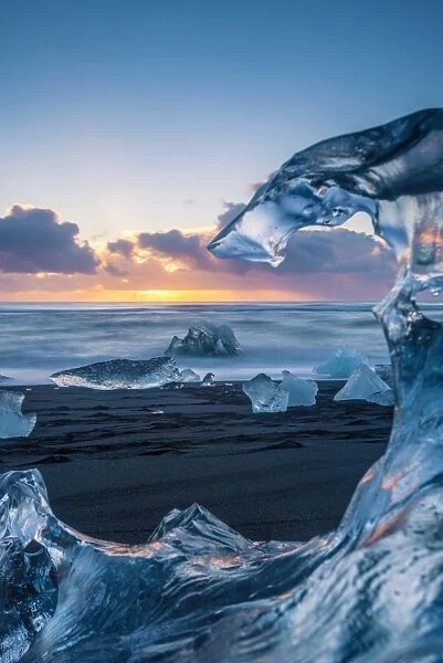 Jokulsarlon, Iceland. The black Breidamerkursandur beach seen through a melted block