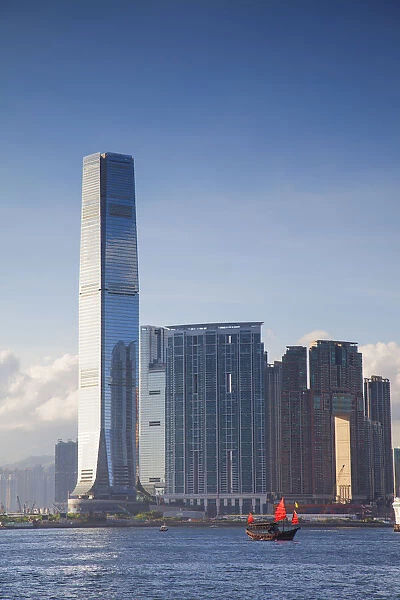 Junk boat passing International Commerce Centre (ICC), West Kowloon, Hong Kong