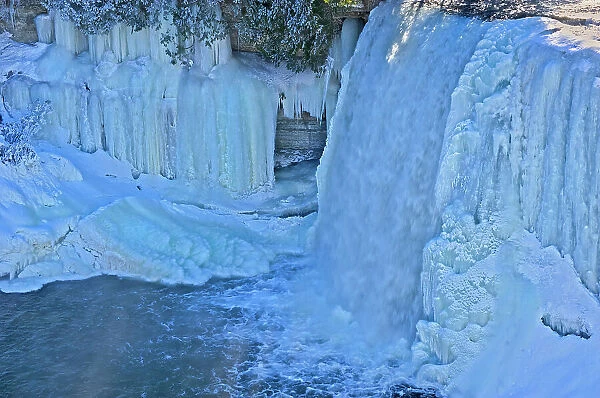 The Kagawong River flows over icy Bridal Veil Falls. Manitoulin Island Kagawong, Ontario, Canada