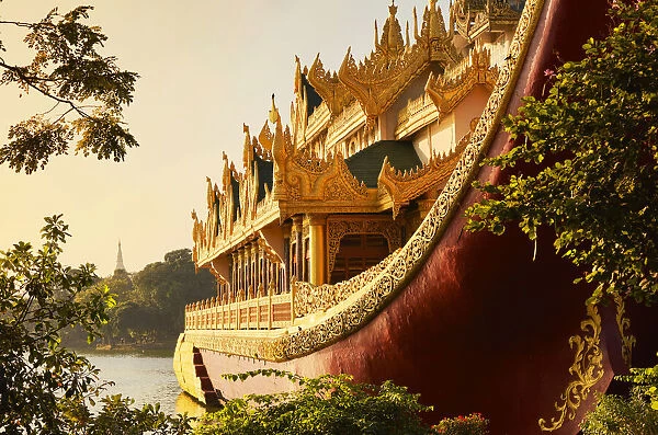 The 'Karaweik'barge with the stupa of the 'Shwedagon Pagoda'