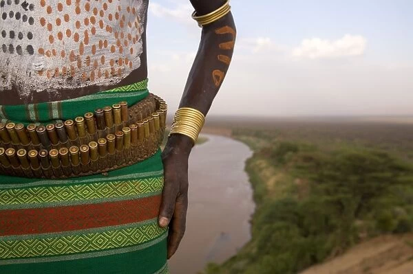 Karo Tribesman wearing a belt of bullets, Lower Omo Valley, Ethiopia