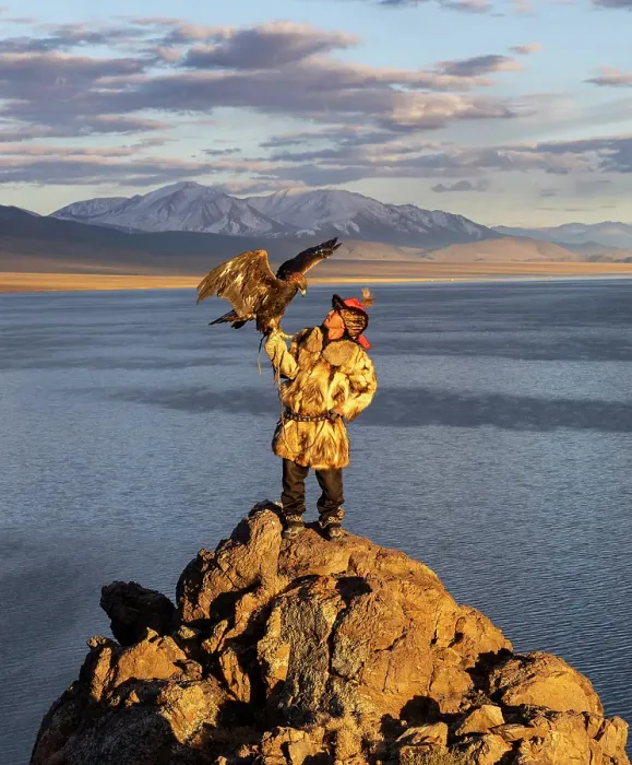 Framed Print : Kazakh Eagle Hunter with his Golden Eagle at sunset against a mountainous backdrop, Tolbo Lake, Western Mongolia, Asia Framed Print : Kazakh Eagle Hunter with his Golden Eagle at sunset against a mountainous backdrop, Tolbo Lake, Western Mongolia, Asia