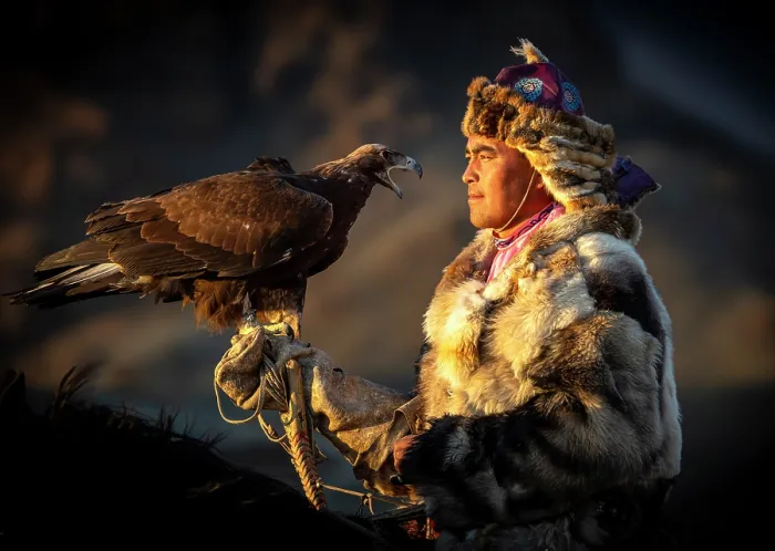 Framed Print : Kazakh Eagle Hunter on horseback wearing traditional fur clothing and posing with his trained golden eagle, Bayan-Ulgii Province, Western Mongolia Framed Print : Kazakh Eagle Hunter on horseback wearing traditional fur clothing and posing with his trained golden eagle, Bayan-Ulgii Province, Western Mongolia