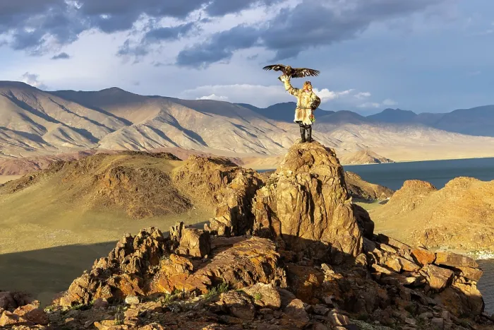 Framed Print : Kazakh Eagle Hunter wearing traditional fur clothing and posing with his trained golden eagle, Bayan-Ulgii Province, Western Mongolia Framed Print : Kazakh Eagle Hunter wearing traditional fur clothing and posing with his trained golden eagle, Bayan-Ulgii Province, Western Mongolia