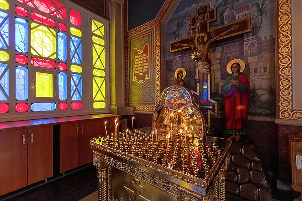 Kazakhstan, Almaty, Zenkov Russian orthodox cathedral interior, a candlelit altar