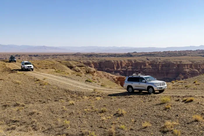 Framed Print : Kazakhstan, Charyn Canyon, 4-wheel drives travel through the canyon Framed Print : Kazakhstan, Charyn Canyon, 4-wheel drives travel through the canyon