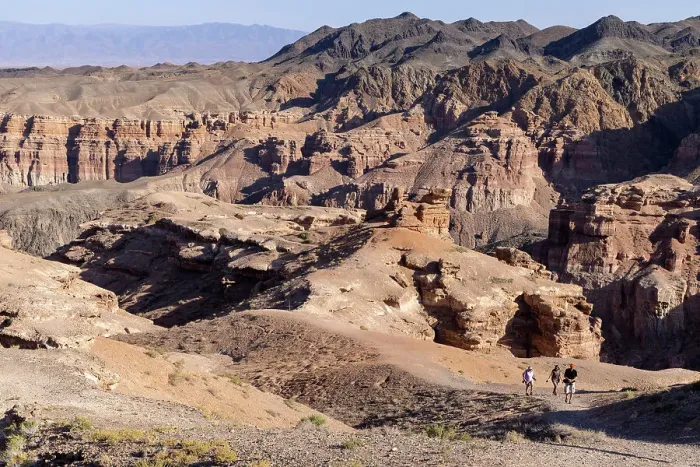 Framed Print : Kazakhstan, Charyn Canyon National Park, visitors hike through the canyon Framed Print : Kazakhstan, Charyn Canyon National Park, visitors hike through the canyon