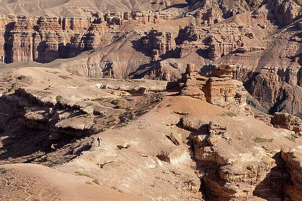 Kazakhstan, Charyn Canyon, a visitor walks through the canyon