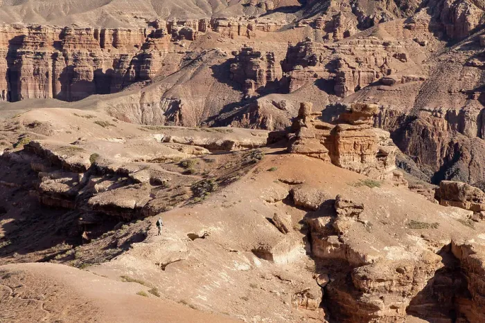 Framed Print : Kazakhstan, Charyn Canyon, a visitor walks through the canyon Framed Print : Kazakhstan, Charyn Canyon, a visitor walks through the canyon