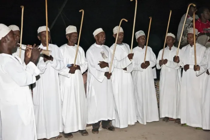Framed Print : Kenya. The Swahili elite, Wangwana, perform the traditional stick dance during Maulidi, celebration of Prophet Mohammeds birthday