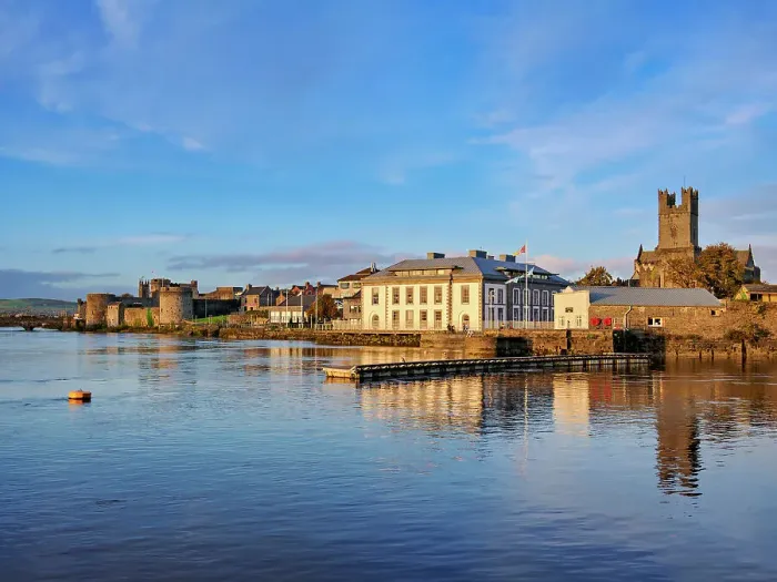 Framed Print : King John's Castle and Saint Mary's Cathedral reflecting in River Shannon at sunset, Limerick, County Limerick, Ireland