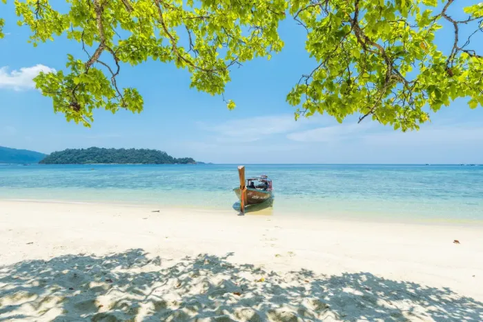 Framed Print : Ko Lipe, Satun Province, Thailand. Traditional long tail boat moored on an empty beach Framed Print : Ko Lipe, Satun Province, Thailand. Traditional long tail boat moored on an empty beach
