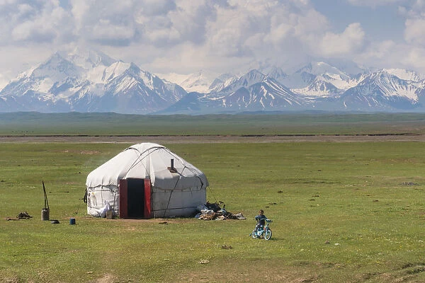 Kyrgyzstan landscape with a Yurt and children in foreground