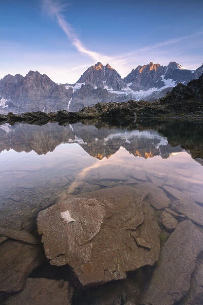Lake of Forbici during sunrise and in background Bernina Group, Valmalenco, Valtellina, Sondrio Province, Lombardy, Italy