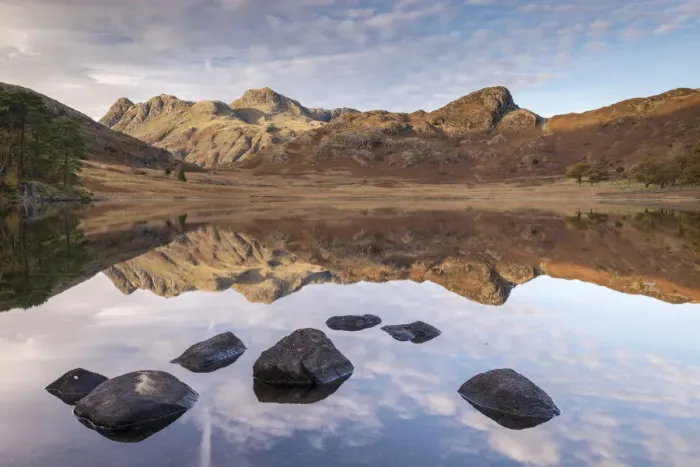 Framed Print : The Langdale Pikes mountains reflected in the mirror still water of Blea Tarn Framed Print : The Langdale Pikes mountains reflected in the mirror still water of Blea Tarn