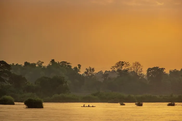 Framed Print : Laos, Champasak Province, Si Phan Don (4000 islands), Mekong river, sunset view of fishermen on the river. Forest silhouetted behind, orange glow in the sky and water Framed Print : Laos, Champasak Province, Si Phan Don (4000 islands), Mekong river, sunset view of fishermen on the river. Forest silhouetted behind, orange glow in the sky and water