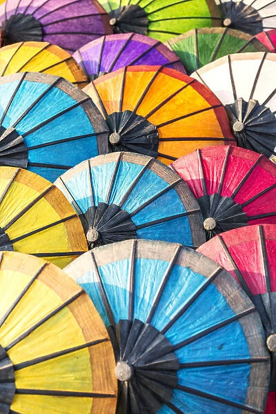 Laos, Luang Prabang. Colorful sa paper umbrellas for sale at the local market