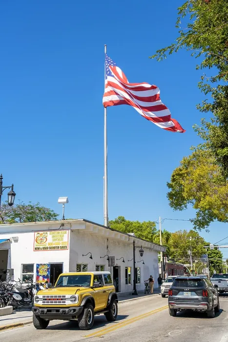 Framed Print : Large American flag on Truman Avenue, Key West, Florida, USA Framed Print : Large American flag on Truman Avenue, Key West, Florida, USA