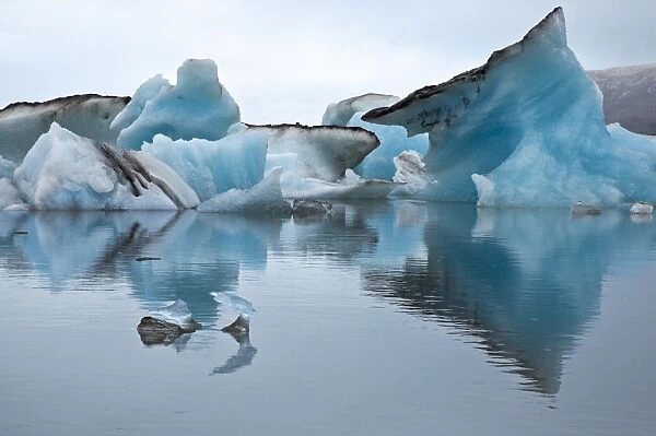 Large blocks of ice floating on Jokulsarlon lagoon. These blocks break off from the 30-metres-high edge of the Breidamerkurjokull glacier, keeping the deep lagoon always stocked with amazing