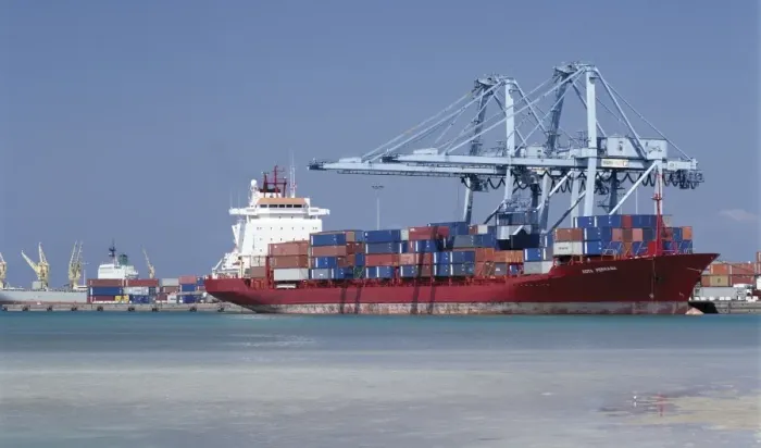 Framed Print : A large container vessel discharges its cargo at the port of Djibouti Framed Print : A large container vessel discharges its cargo at the port of Djibouti