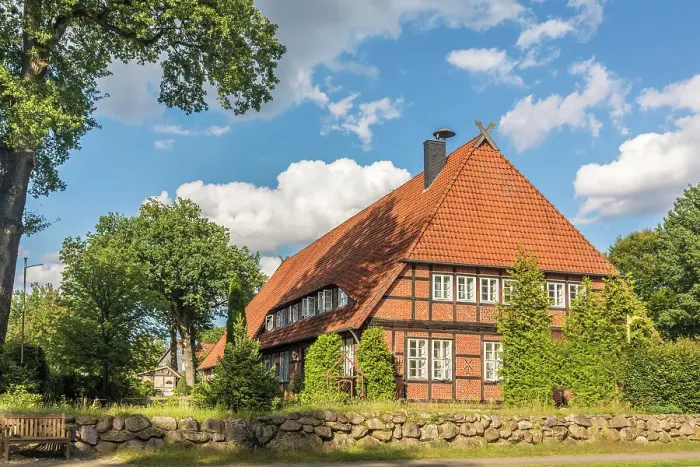 Framed Print : Large historic brick half-timbered farm in the village of Mueden (Oertze), Luneburg Heath, Lower Saxony, Germany Framed Print : Large historic brick half-timbered farm in the village of Mueden (Oertze), Luneburg Heath, Lower Saxony, Germany