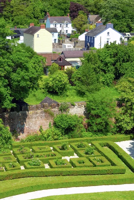 Framed Print : Laugharne Castle (Castell Talacharn) walled garden as seen from the castle walls, with the town of Laugharne in the background, Carmarthenshire, Wales Framed Print : Laugharne Castle (Castell Talacharn) walled garden as seen from the castle walls, with the town of Laugharne in the background, Carmarthenshire, Wales