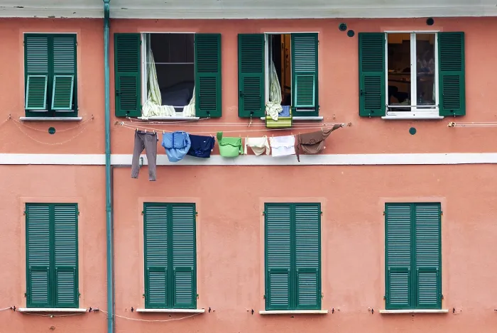 Framed Print : Laundry hanging on the wall of a house with green window shutters, Vernazza, Cinque Terre, La Spezia district, Liguria, Italy Framed Print : Laundry hanging on the wall of a house with green window shutters, Vernazza, Cinque Terre, La Spezia district, Liguria, Italy