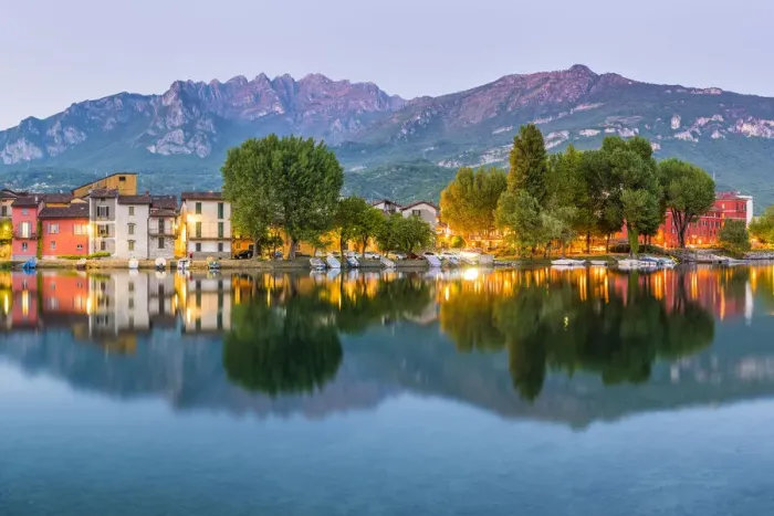 Framed Print : Lecco, Lombardy, Italy. Colorful houses and the Mount Resegone reflected onto Framed Print : Lecco, Lombardy, Italy. Colorful houses and the Mount Resegone reflected onto