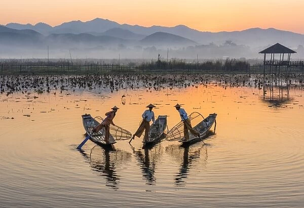 Leg-rowing fishermen of Inle Lake at dawn, Shan State, Myanmar