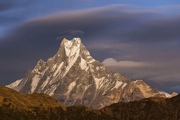 Lenticular clouds forming above Machapuchare, Himalayas, Nepal