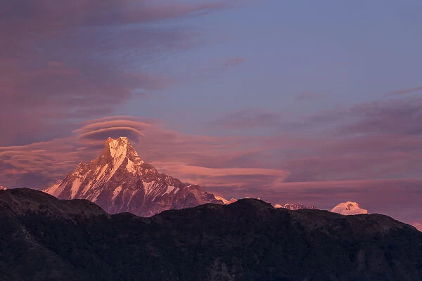 Lenticular clouds at sunset above Machapuchare, Himalayas, Nepal