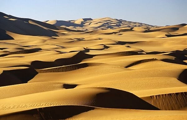 Libya, Fezzan, Edeyen Ubari, near Ubari. Seemingly endless dunes stretch to the horizon in the immense sand sea of