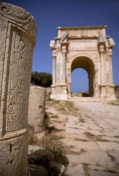 Libya; Tripolitania; Khums; An inscription on a stone and the Arch of Septimius Severus