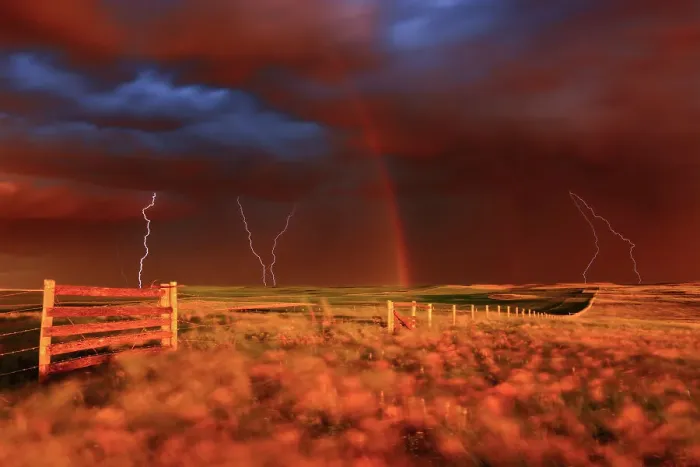 Framed Print : Lightning strikes, rainbow and setting sun during prairie storm. West Block Grasslands National Park Saskatchewan, Canada