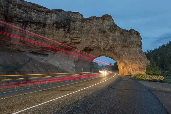 Lights of cars passing through Red Canyon Tunnel on scenic byway 12. Garfield County