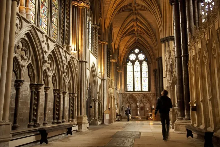 Framed Print : Lincoln, England. A visitor gazes at the medieval stained glass in Lincoln cathedral Framed Print : Lincoln, England. A visitor gazes at the medieval stained glass in Lincoln cathedral