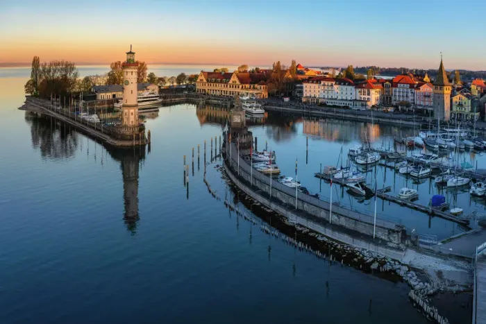 Framed Print : Lindau harbour with Mangturm Tower and Lighthouse at Sunrise, Lake Constance, Swabia, Bavaria, Germany Framed Print : Lindau harbour with Mangturm Tower and Lighthouse at Sunrise, Lake Constance, Swabia, Bavaria, Germany