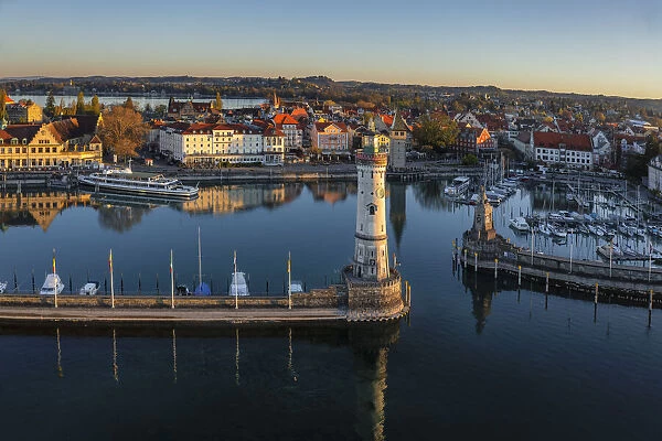 Lindau harbour with Mangturm Tower and Lighthouse at Sunrise, Lake Constance, Swabia, Bavaria, Germany