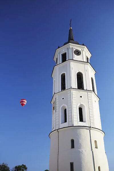 Lithuania, Vilnius, Hot Air Balloon Flying Past Vilnius Cathedral Belfry