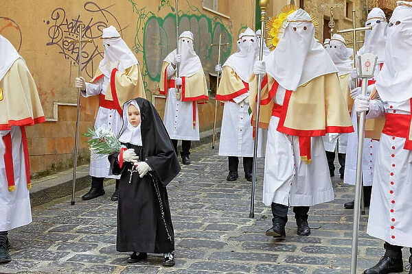 Little girl dressed like a nun leading Good Friday Procession, Enna, Siclly, Italy