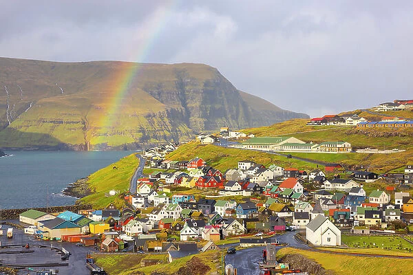 a little village called Eidi under a big rainbow during an autumn day, Eysturoy, Faroe Islands, Denmark