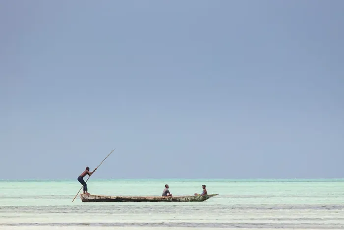 Framed Print : Local fishermen in an open wooden boat on the sea, Jambiani, Zanzibar, Tanzania Framed Print : Local fishermen in an open wooden boat on the sea, Jambiani, Zanzibar, Tanzania