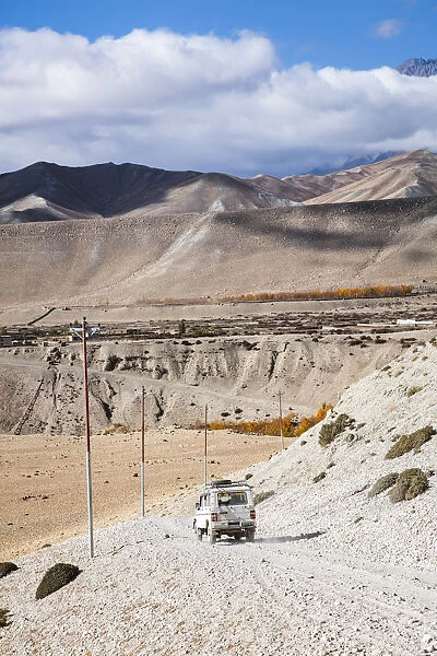 Local tourist jeep, on dirt road, Upper Mustang region, Nepal