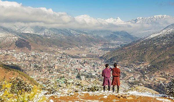 Two locals looking at city of Thimphu, Bhutan