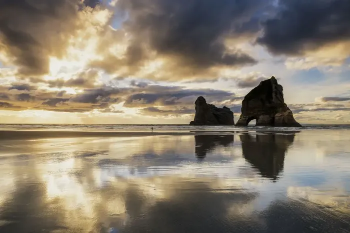 Framed Print : Lone Person on Wharariki Beach at Sunset, New Zealand Framed Print : Lone Person on Wharariki Beach at Sunset, New Zealand