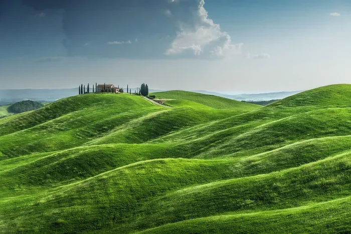 Framed Print : A lonely countryhouse and some rolling hills in the Crete Senesi. Tuscany, Italy