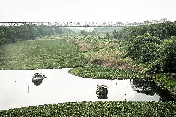 Long Bien Bridge and marshes by the Red River, Hanoi, Vietnam